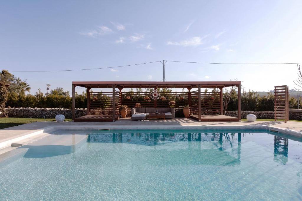 Large outdoor pool with lounge pavilion